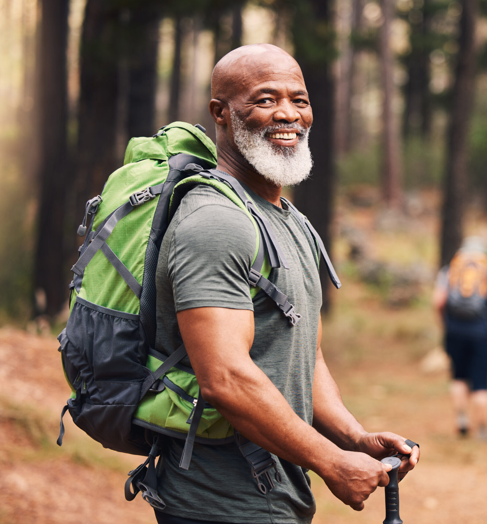 Portrait, black man and hiking in forest, exercise and fitness for wellness, healthy lifestyle and smile. Face, senior male and mature gentleman with backpack, smile and hiker in woods and fresh air.