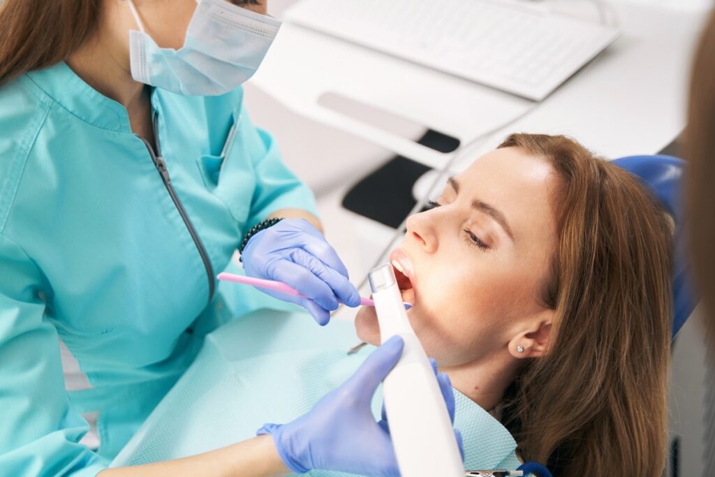 Dentist using a digital intraoral scanner on a patient at Rivers Dentistry