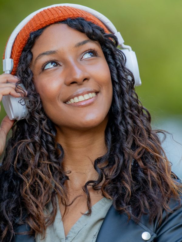 portrait of beautiful young latina woman with headphones