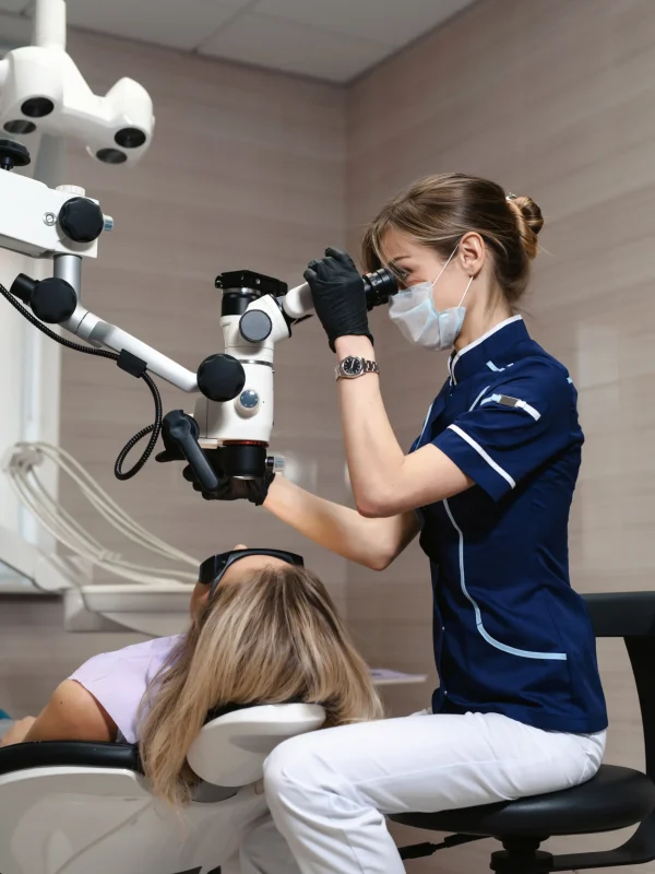 Dental professional performing wisdom tooth extraction consultation at Rivers Dentistry