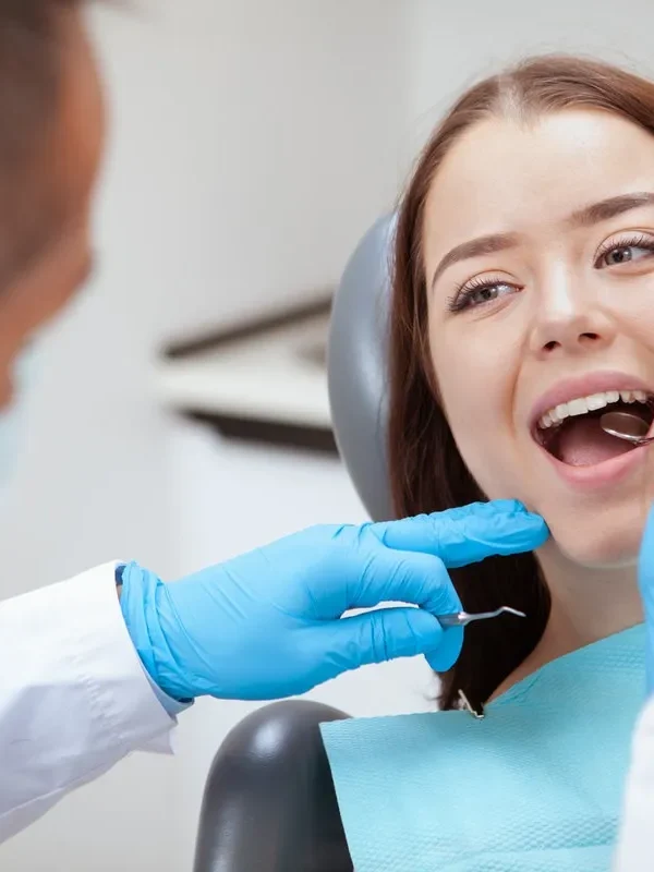 Close up of a lovely young woman having her teeth examined by dentist