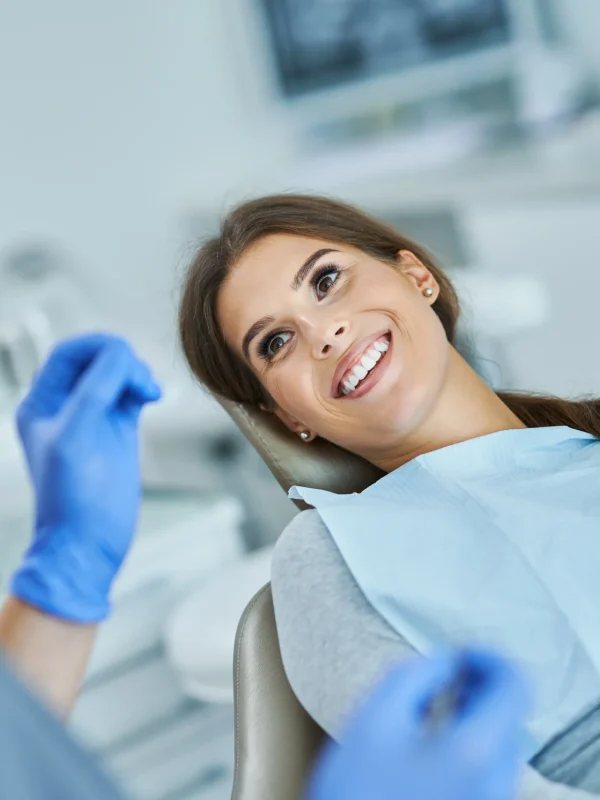 Male dentist and woman in dental clinic