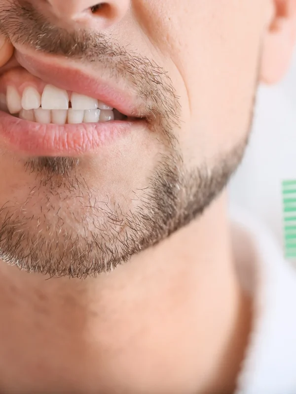 Man suffering from tooth ache in morning, closeup
