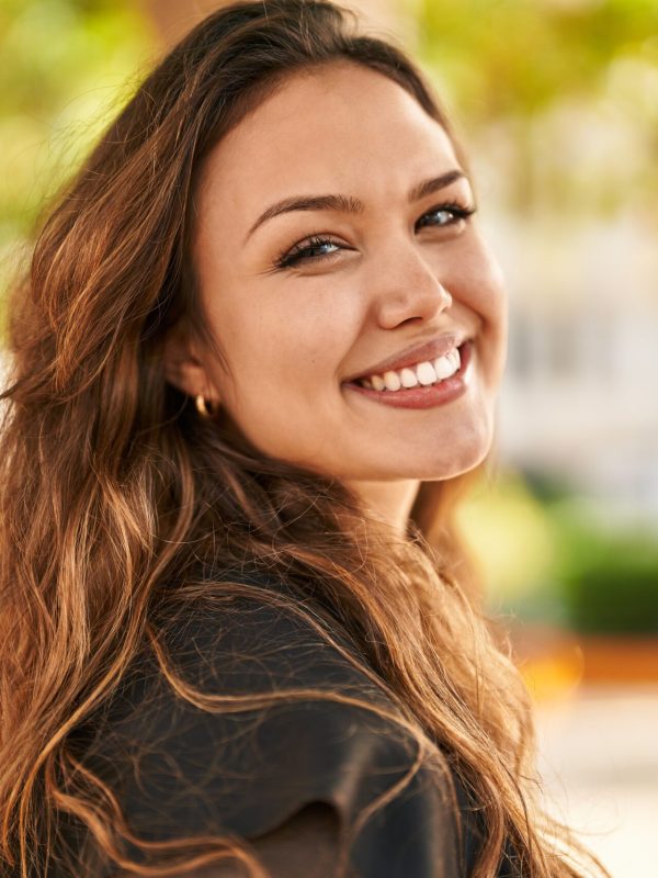 Young beautiful hispanic woman smiling confident standing at park
