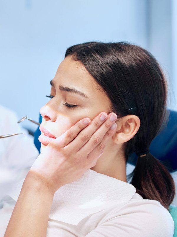 Dental, fear or woman with toothache in dentist consultation for mouth examination, gingivitis or bacteria. Tooth extraction, pain or cosmetic surgeon with tools for cavity, root canal or procedure.
